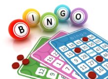 Bingo cards and balls on white reflective surface.Similar images: